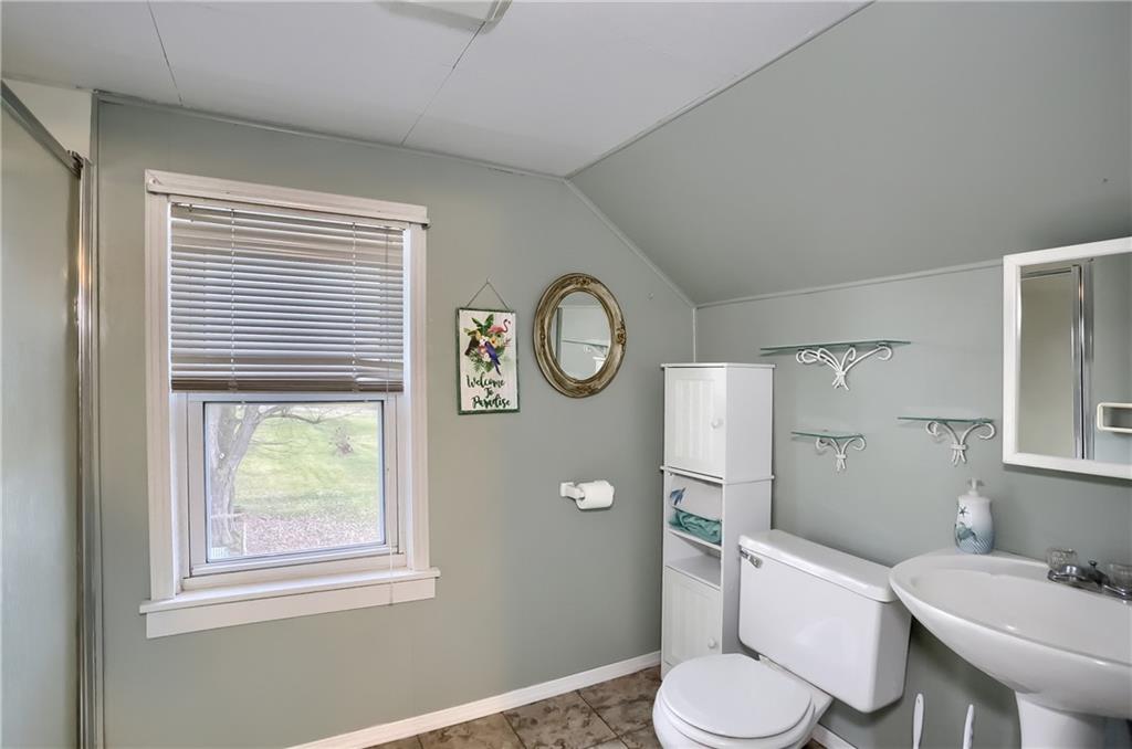 3564 Ellwood Road New Castle, PA 16101 - Photo 23 of 34 a bathroom with a toilet a sink and a window