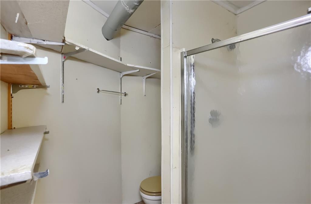 3564 Ellwood Road New Castle, PA 16101 - Photo 28 of 34 a bathroom with a shower and a toilet
