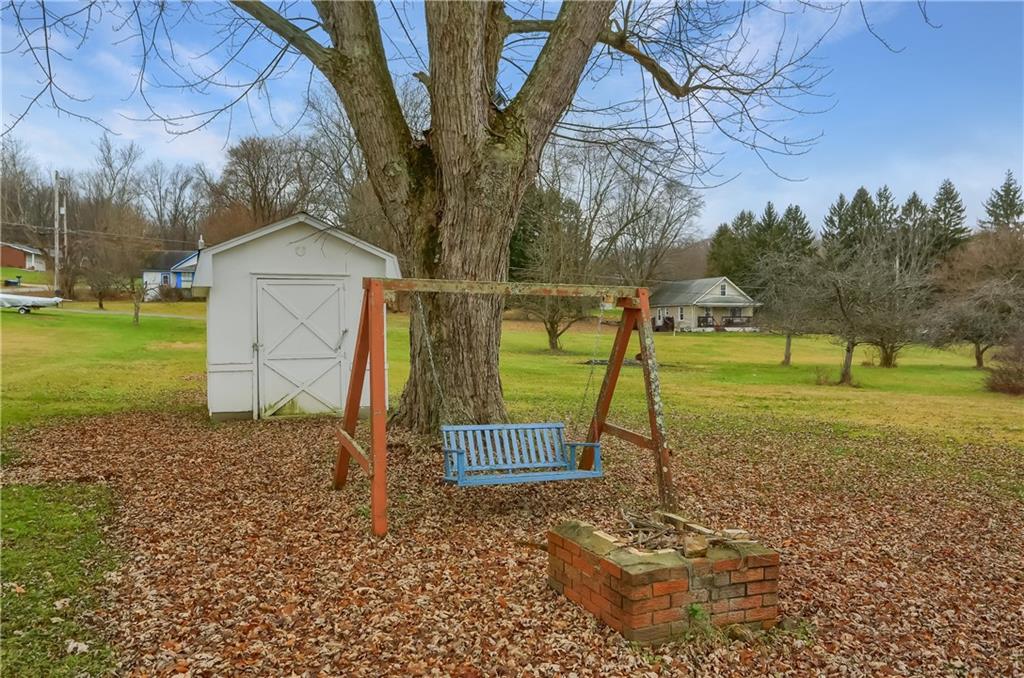 3564 Ellwood Road New Castle, PA 16101 - Photo 33 of 34 a backyard of a house with lots of green space