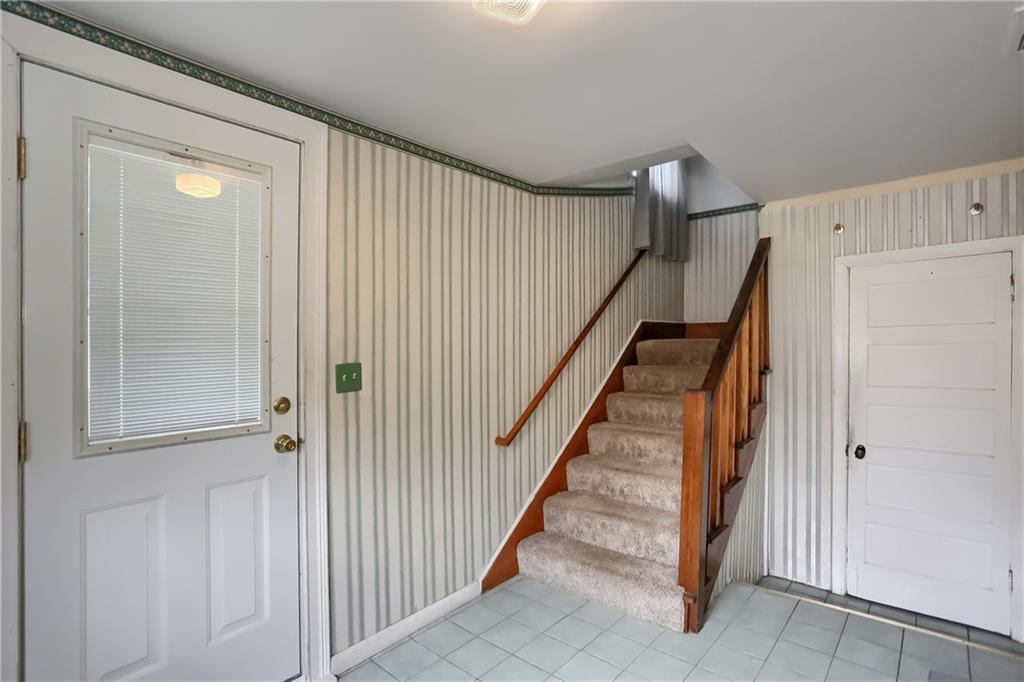 3564 Ellwood Road New Castle, PA 16101 - Photo 5 of 34 a view of a hallway with staircase