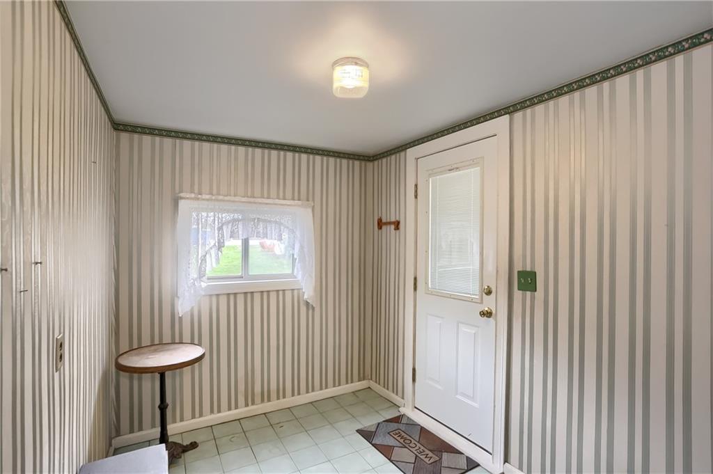 3564 Ellwood Road New Castle, PA 16101 - Photo 6 of 34 a view of a hallway with toilet and a window