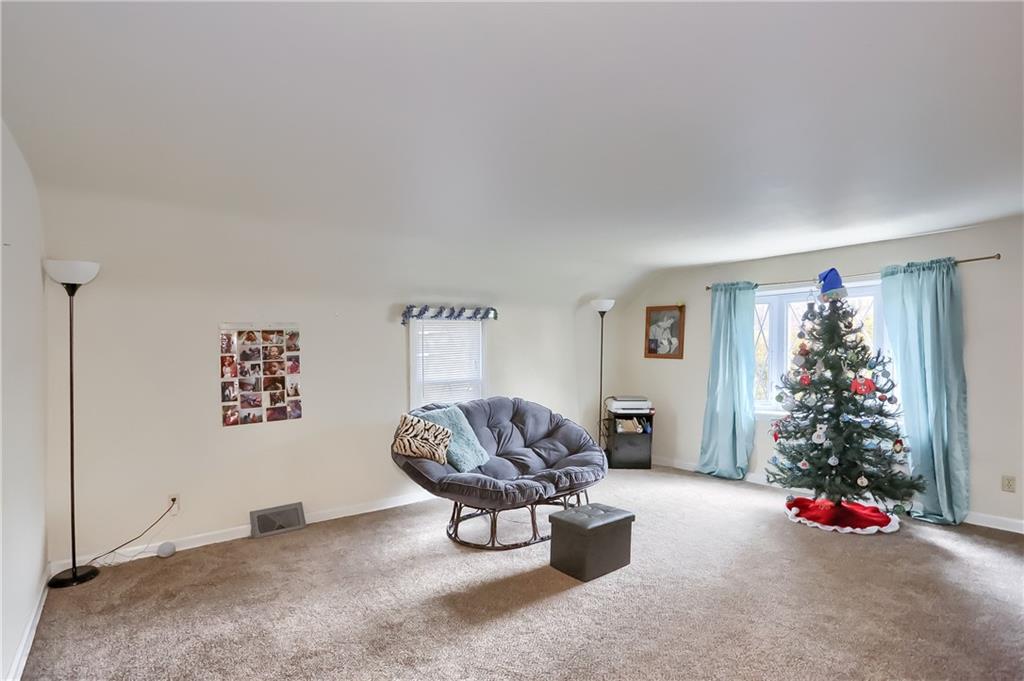 3564 Ellwood Road New Castle, PA 16101 - Photo 10 of 34 a living room with furniture and a potted plant
