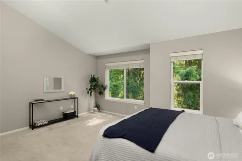 a bedroom with a bed and a fireplace
