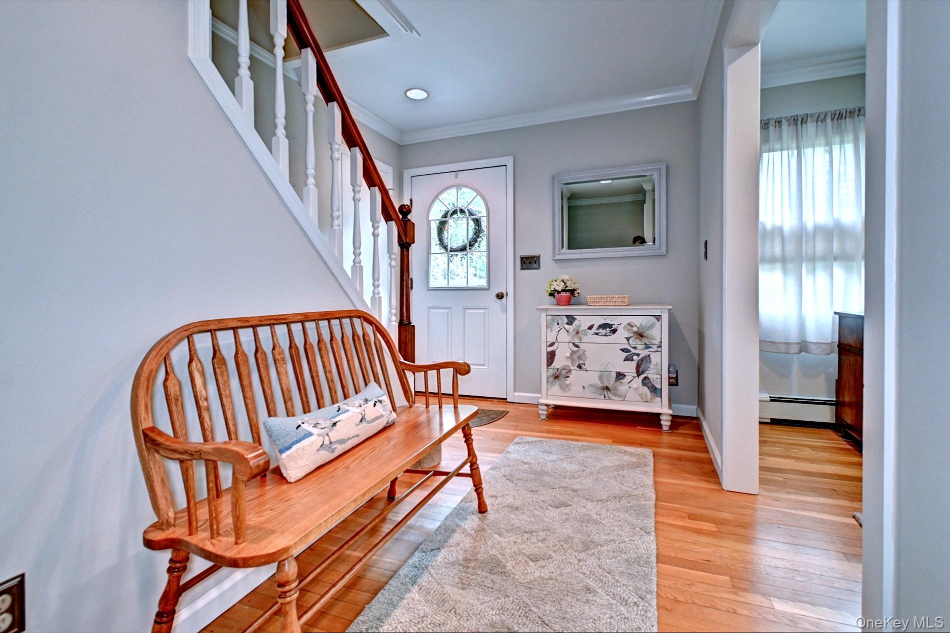 20 Valentine Road Shoreham, NY 11786 - Photo 5 of 39 Foyer with Wood Floors Open to the Dining Area & the Living Room