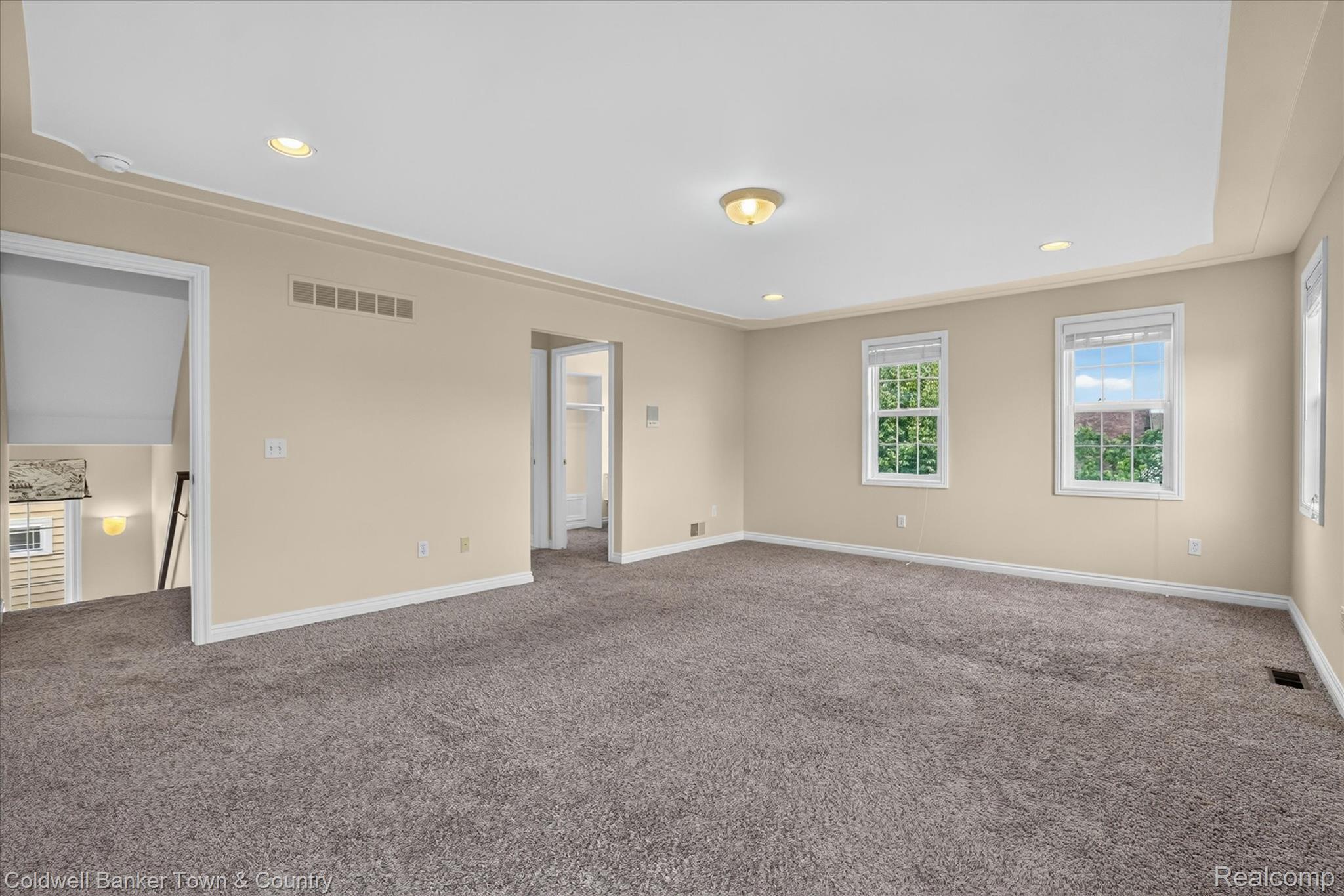 1725 Town Commons Drive Howell, MI 48855 - Photo 30 of 53 Spacious room featuring neutral-toned walls, recessed lighting, and a ceiling fan