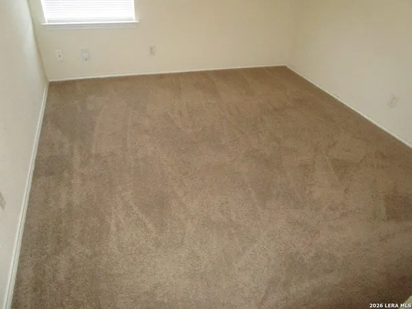 an empty room with a bathroom