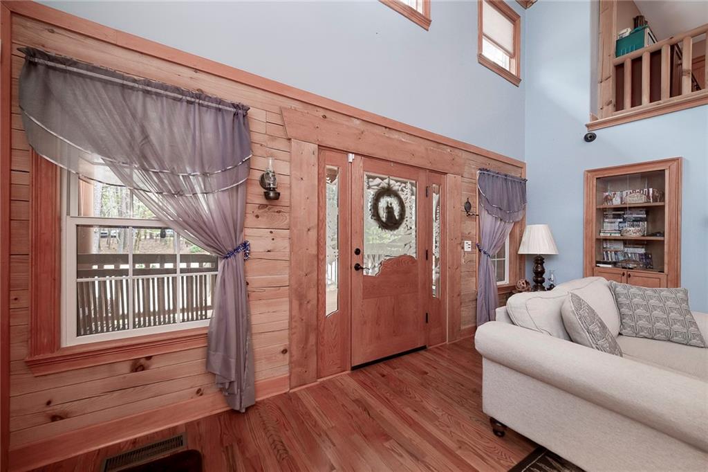 570 Eskew Road McDonough, GA 30252 - Photo 14 of 89 a living room with furniture and wooden floor