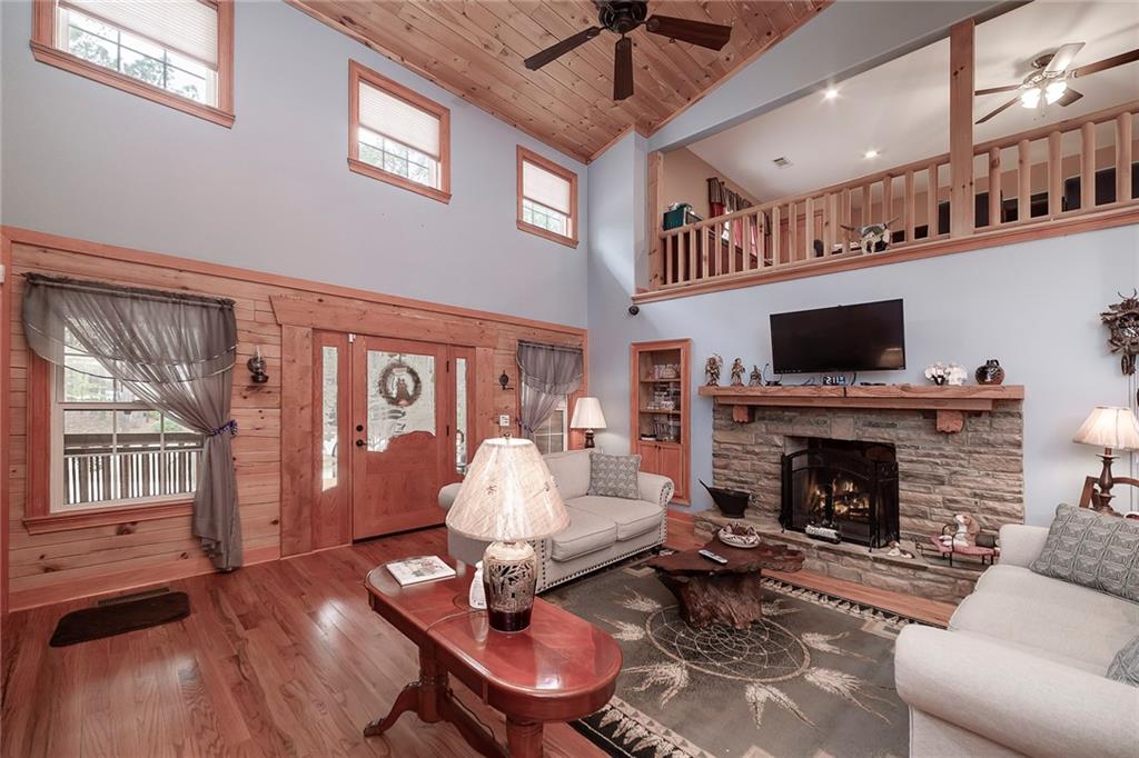 570 Eskew Road McDonough, GA 30252 - Photo 16 of 89 a living room with furniture fireplace and flat screen tv