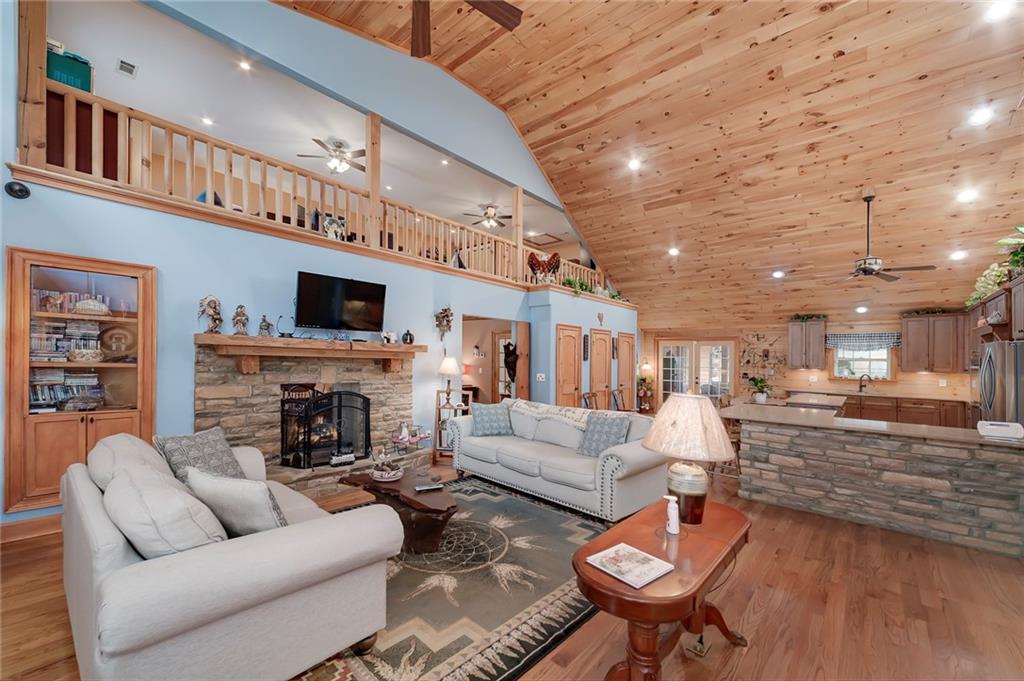 570 Eskew Road McDonough, GA 30252 - Photo 18 of 89 a living room with furniture and a fireplace