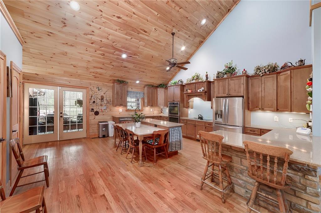 570 Eskew Road McDonough, GA 30252 - Photo 20 of 89 a living room with furniture a wooden floor and next to a window