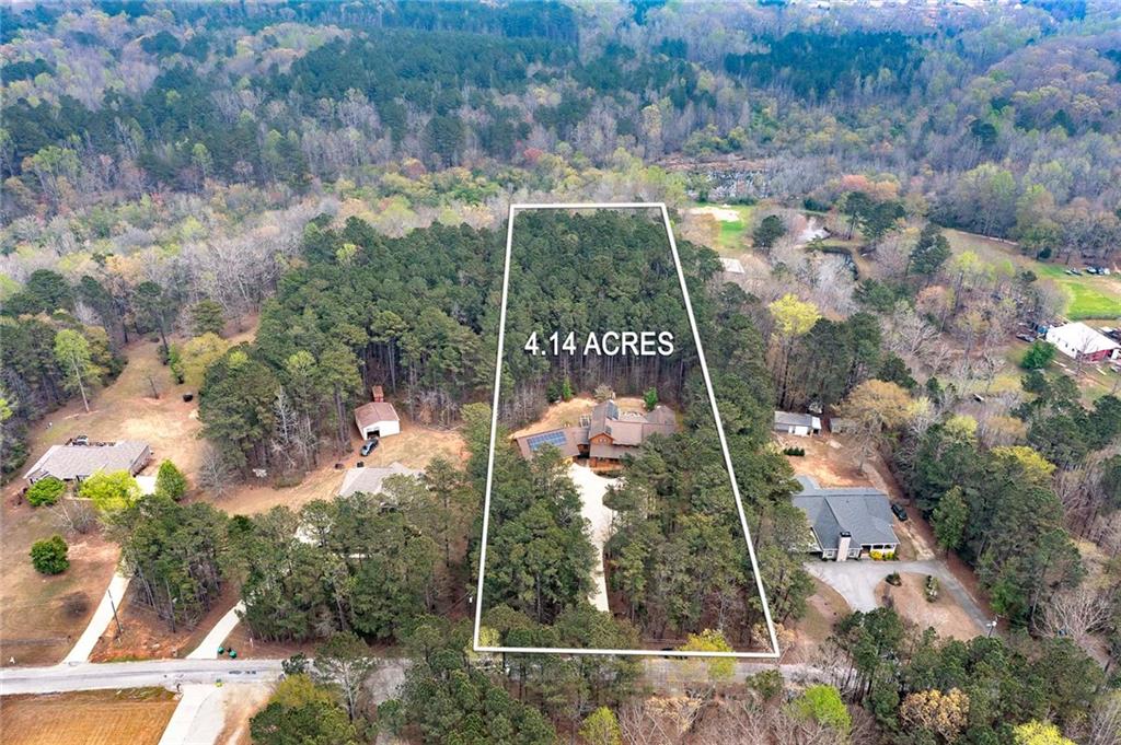 570 Eskew Road McDonough, GA 30252 - Photo 2 of 89 an aerial view of residential house with outdoor space