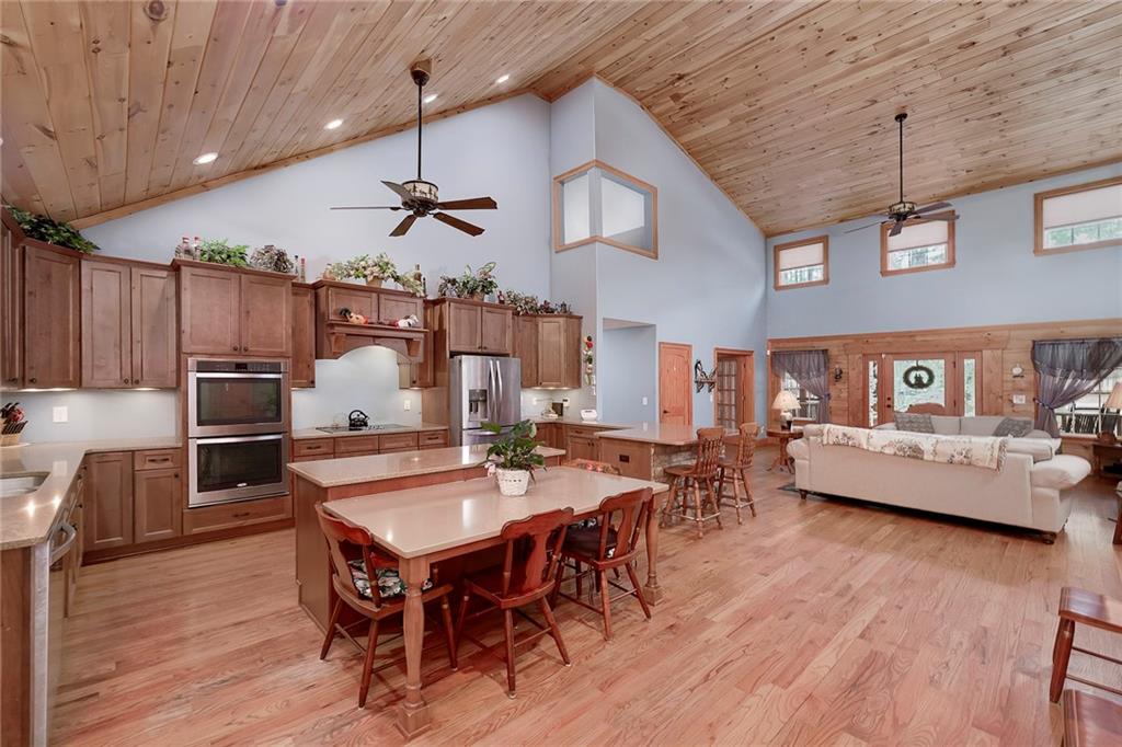 570 Eskew Road McDonough, GA 30252 - Photo 24 of 89 a living room with furniture and wooden floor