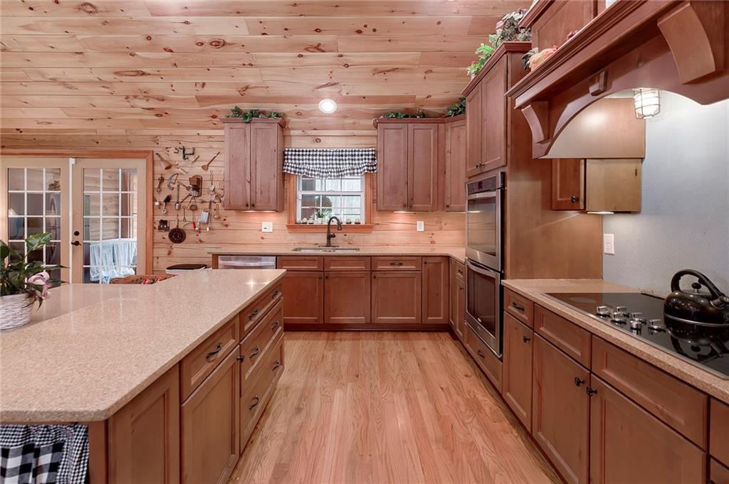 570 Eskew Road McDonough, GA 30252 - Photo 27 of 89 a kitchen with lots of counter top space and appliances