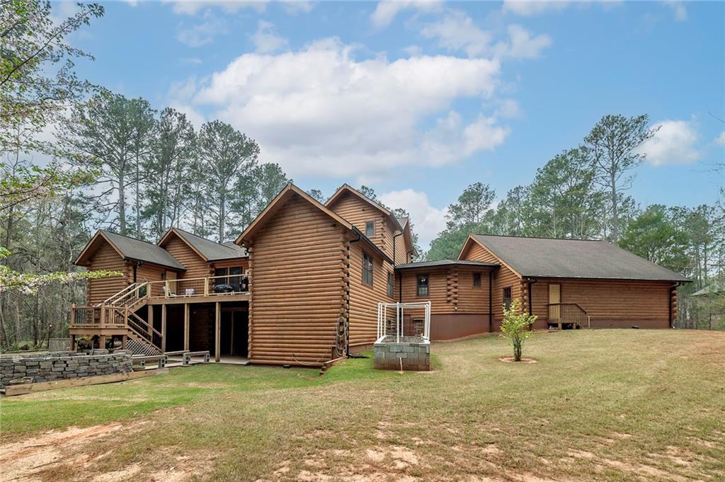 570 Eskew Road McDonough, GA 30252 - Photo 3 of 89 a front view of a house with a garden and yard