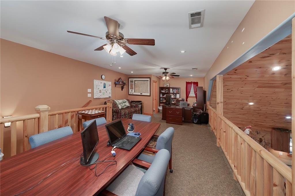 570 Eskew Road McDonough, GA 30252 - Photo 32 of 89 a living room with furniture and a wooden floor