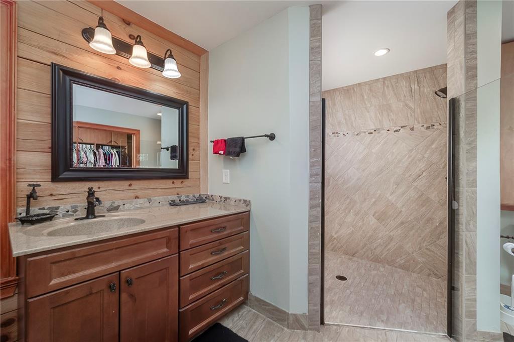 570 Eskew Road McDonough, GA 30252 - Photo 39 of 89 a bathroom with a sink and a mirror