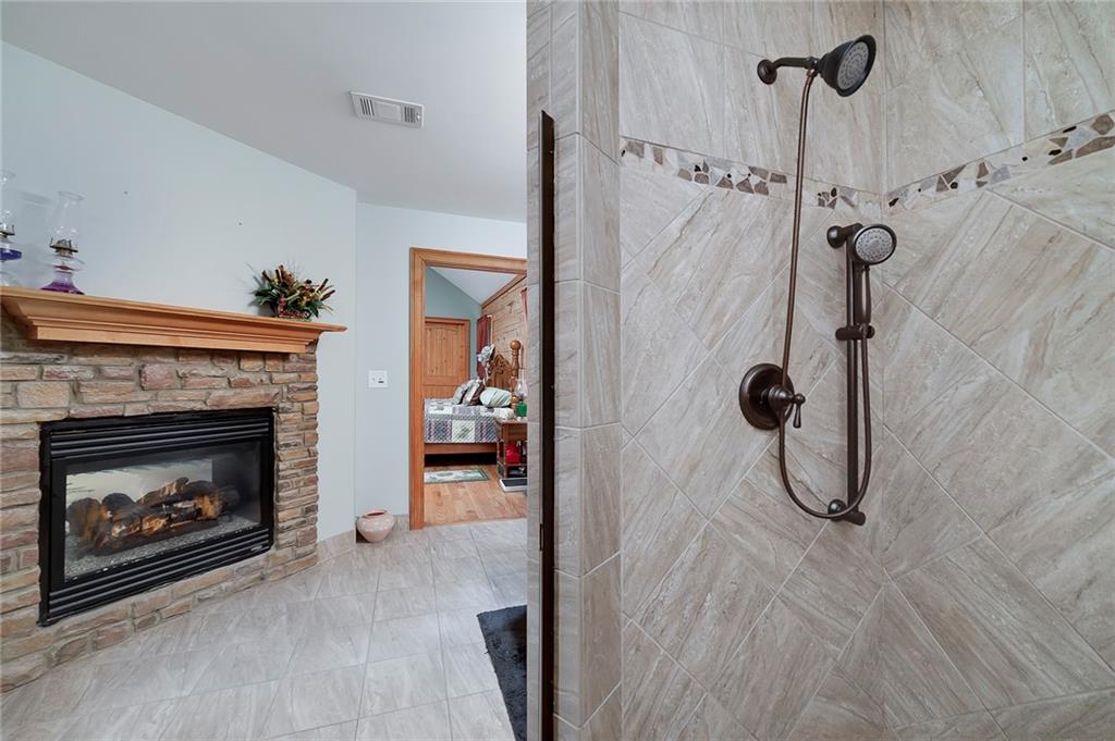 570 Eskew Road McDonough, GA 30252 - Photo 40 of 89 a room with a fireplace and a shower