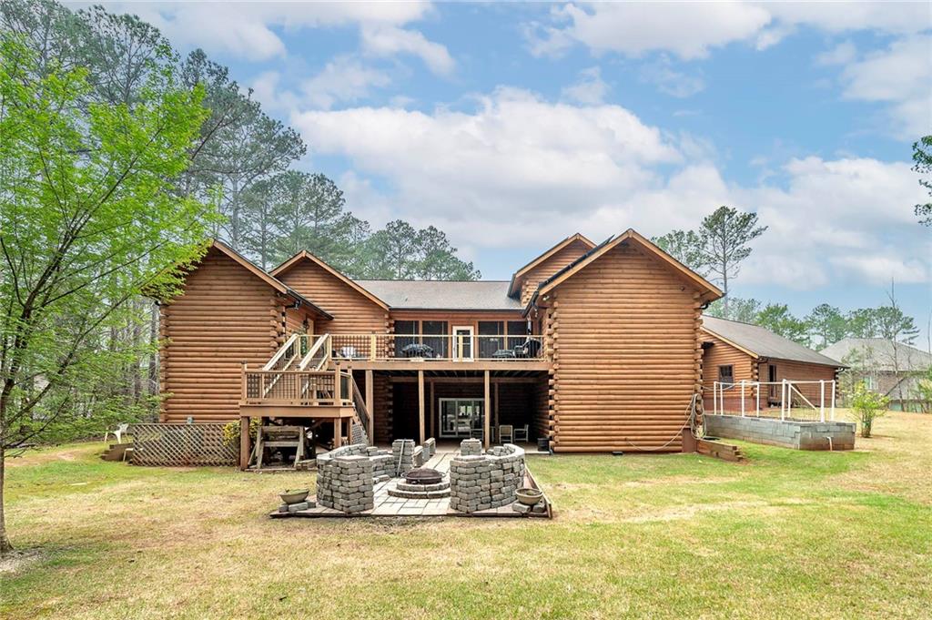 570 Eskew Road McDonough, GA 30252 - Photo 4 of 89 a backyard of a house with table and chairs