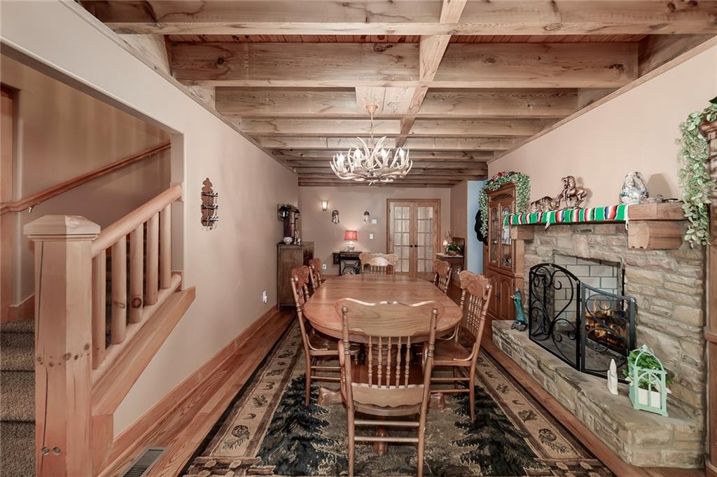 570 Eskew Road McDonough, GA 30252 - Photo 50 of 89 a view of a dining room with furniture wooden floor and a chandelier