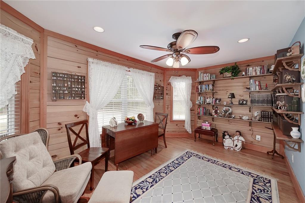 570 Eskew Road McDonough, GA 30252 - Photo 51 of 89 a living room with furniture and a chandelier