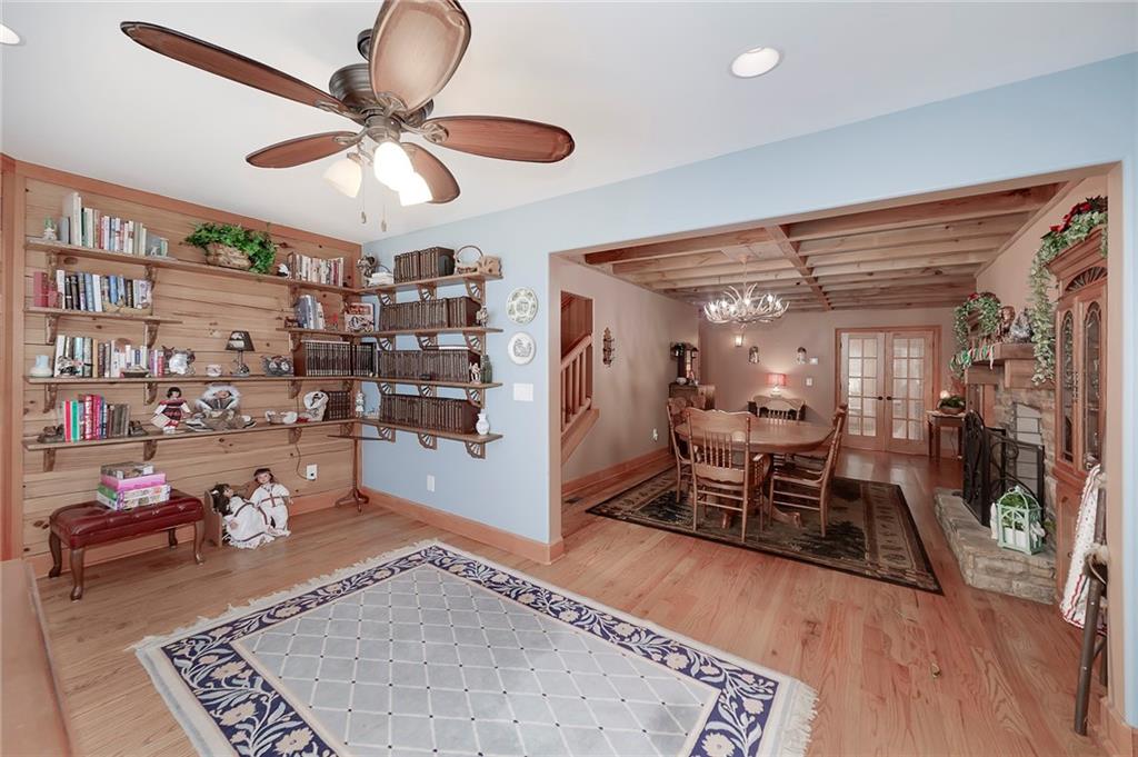 570 Eskew Road McDonough, GA 30252 - Photo 52 of 89 a living room with lots of furniture and gym equipment