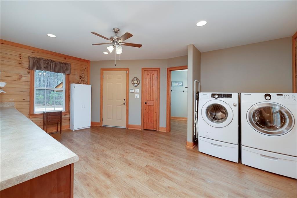 570 Eskew Road McDonough, GA 30252 - Photo 59 of 89 a view of a kitchen with a stove fridge and wooden floor