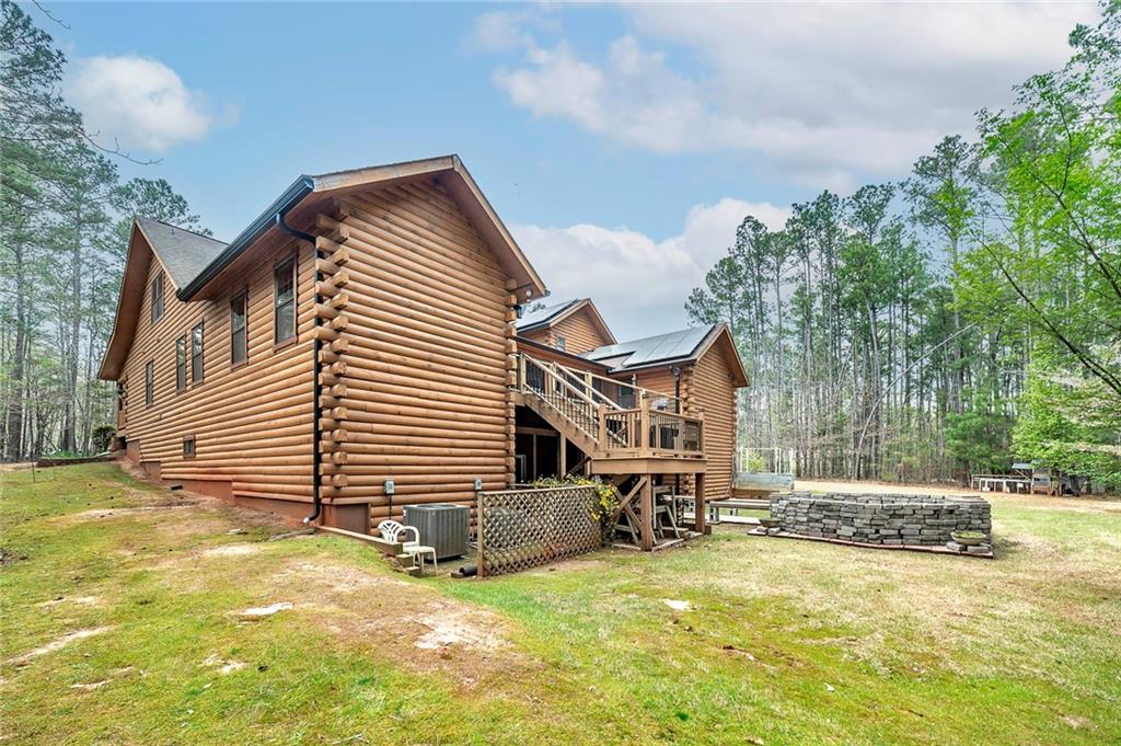 570 Eskew Road McDonough, GA 30252 - Photo 6 of 89 a view of house with yard and trees in the background
