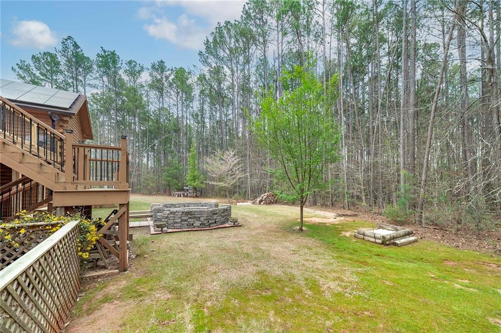 570 Eskew Road McDonough, GA 30252 - Photo 7 of 89 a backyard of a house with lots of green space and fountain