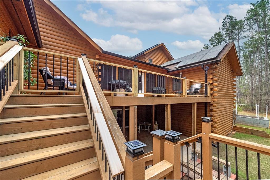 570 Eskew Road McDonough, GA 30252 - Photo 73 of 89 a view of a house with backyard and deck