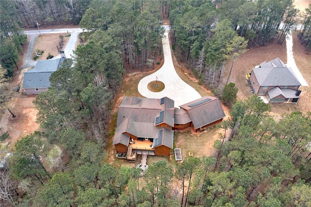 570 Eskew Road McDonough, GA 30252 - Photo 86 of 89 an aerial view of a house with outdoor space pool seating area and yard