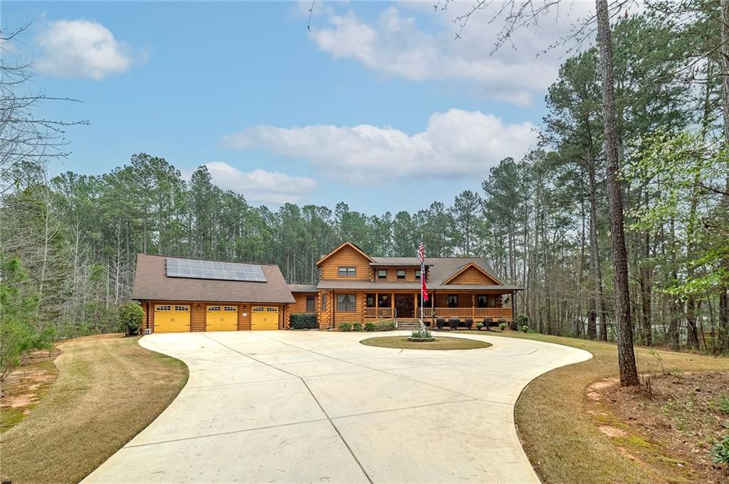 570 Eskew Road McDonough, GA 30252 - Photo 88 of 89 a front view of a house with a garden