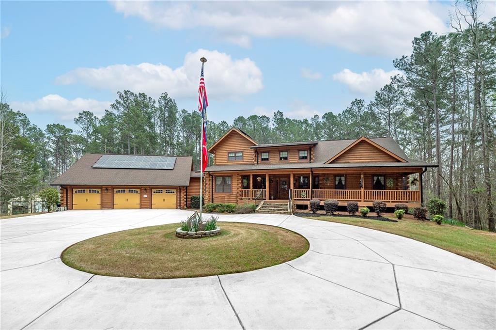 570 Eskew Road McDonough, GA 30252 - Photo 10 of 89 a front view of a house with a yard and trees