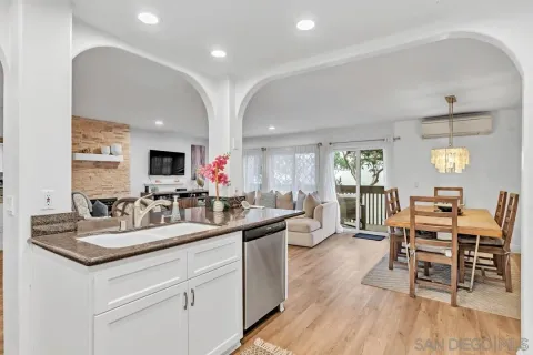 a kitchen with sink and cabinets