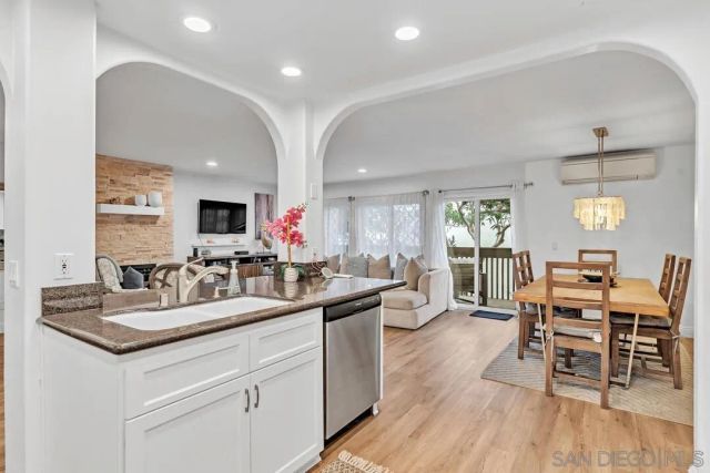 a kitchen with sink and cabinets