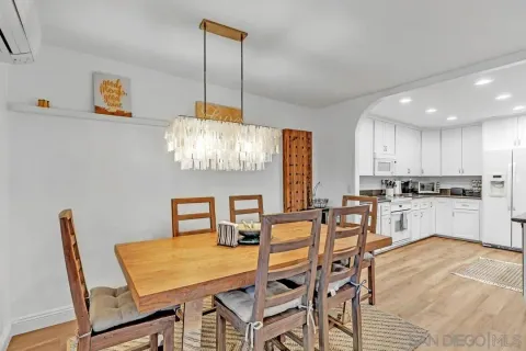 a view of a dining room with furniture and window