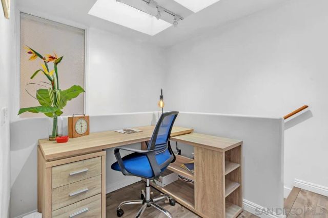 a view of a workspace with furniture