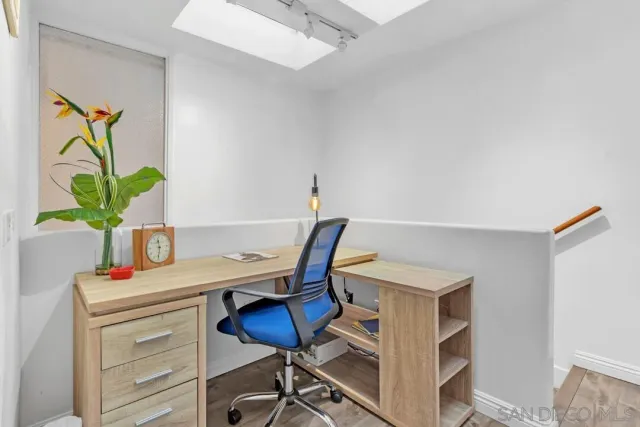 a view of a workspace with furniture