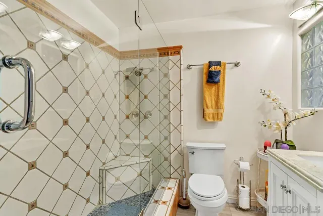 a bathroom with a toilet and a sink