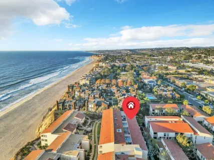 an aerial view of residential building with an ocean view