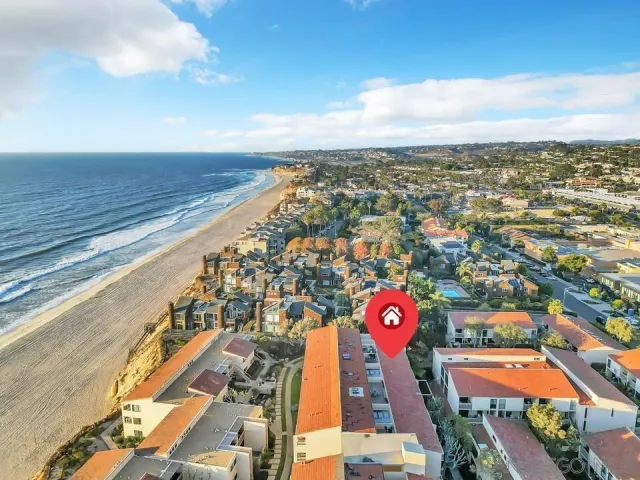 an aerial view of residential building with an ocean view