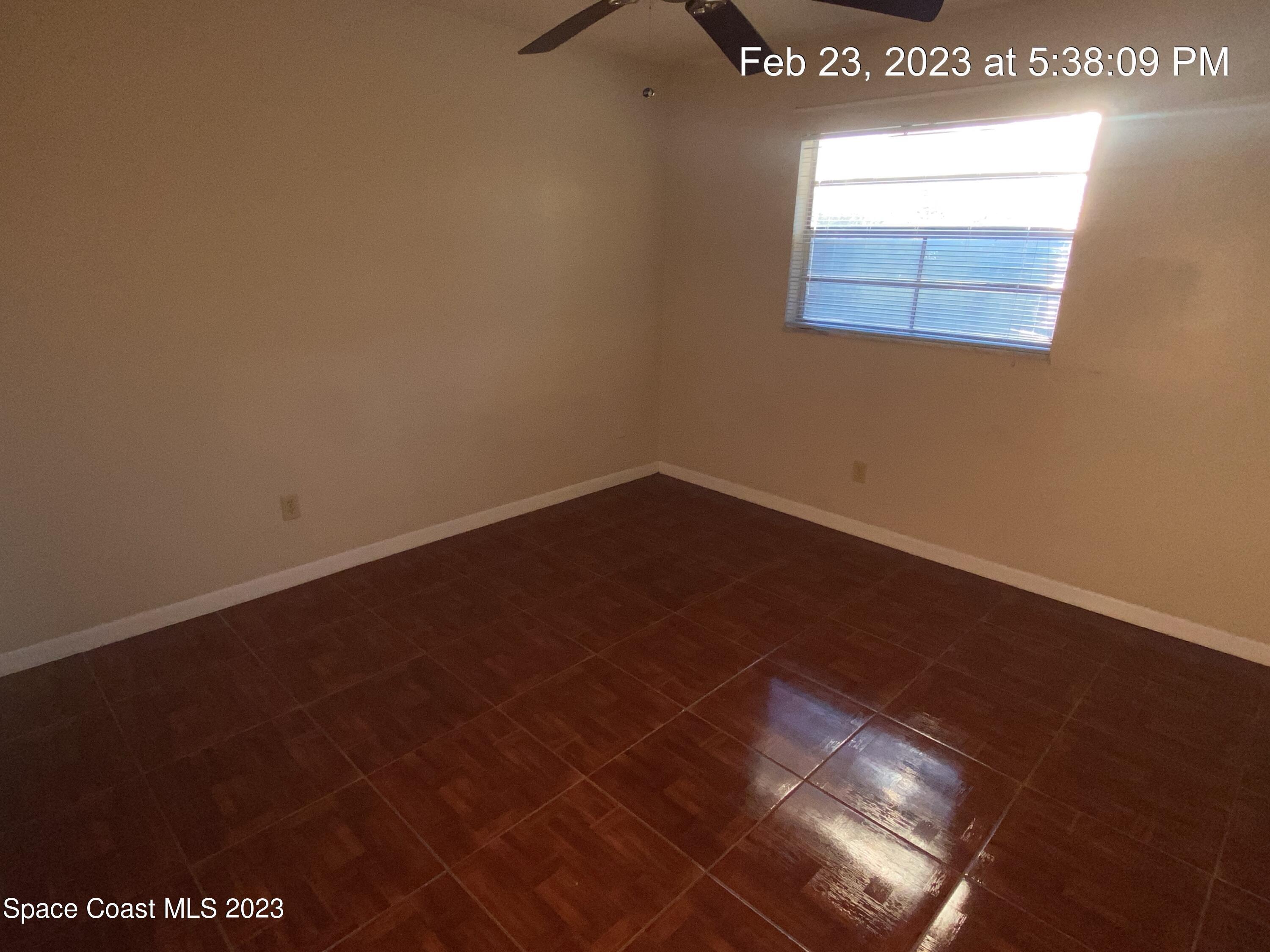 304 Darrow Avenue Melbourne, FL 32901 - Photo 12 of 31 an empty room with a window