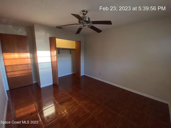 a view of an empty room with glass door