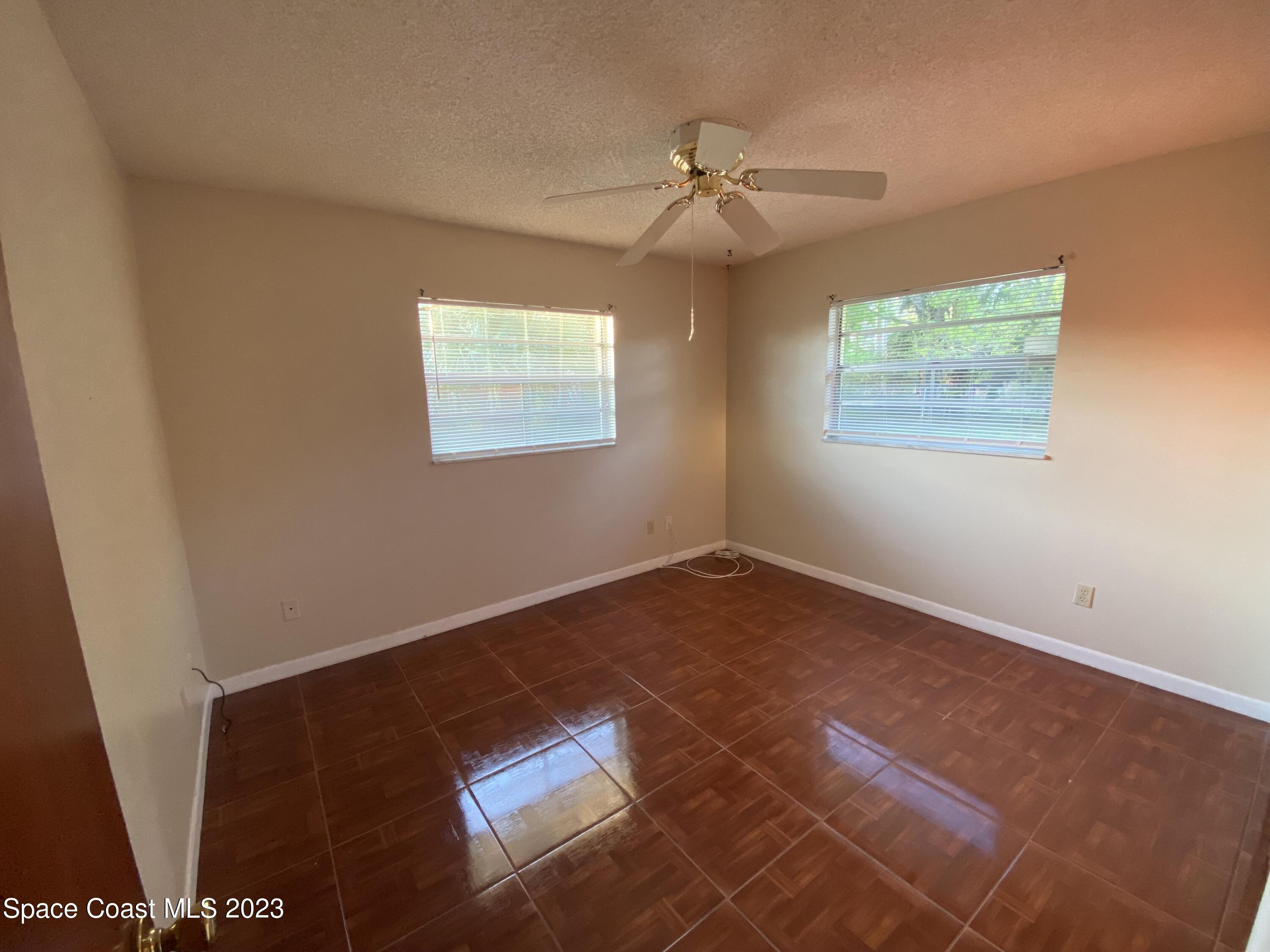 304 Darrow Avenue Melbourne, FL 32901 - Photo 17 of 31 a view of an empty room with a window