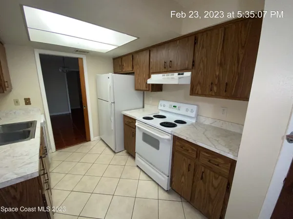 a kitchen with stainless steel appliances a stove a refrigerator and a sink