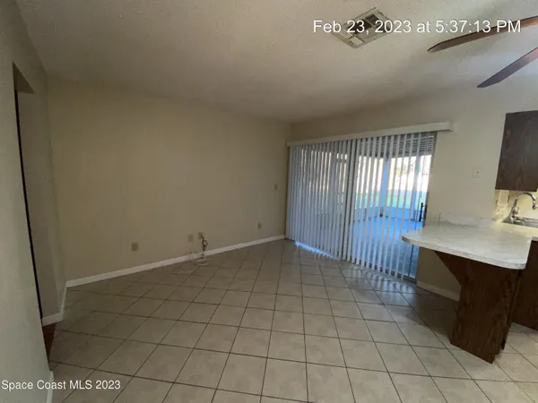 a view of an empty room and window