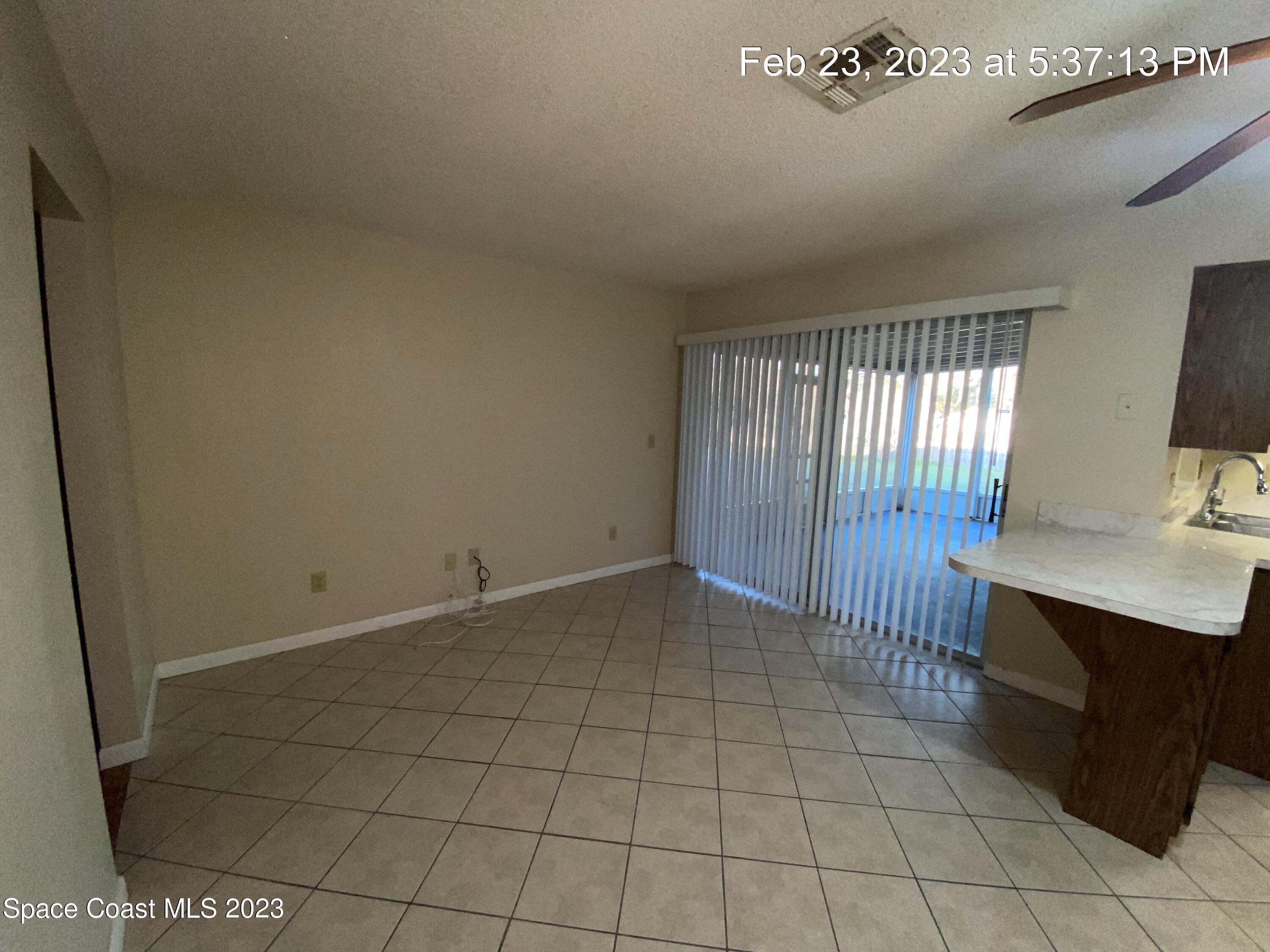 304 Darrow Avenue Melbourne, FL 32901 - Photo 8 of 31 a view of an empty room and window