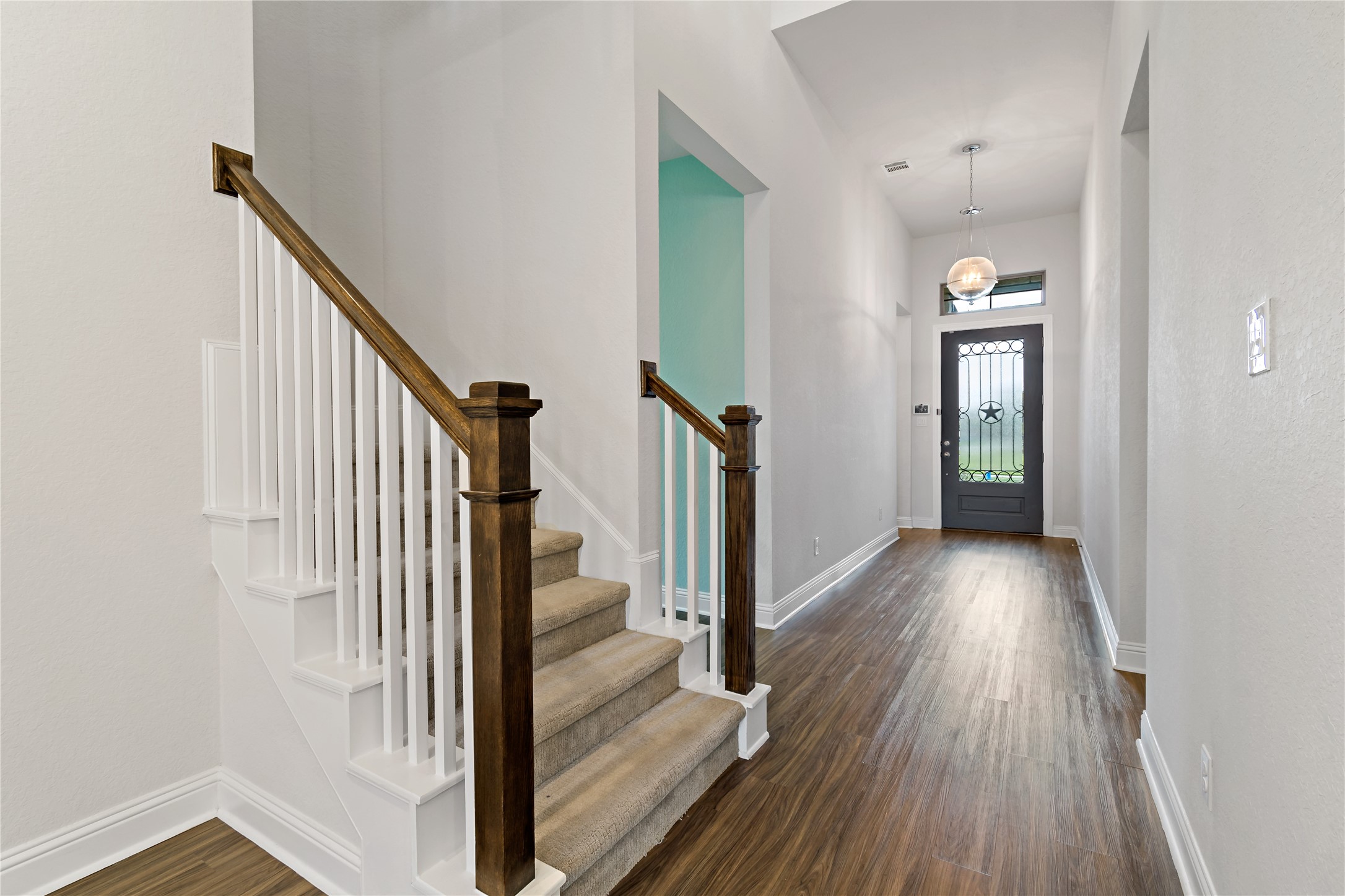4802 Gingerwood Trace Lane Rosharon, TX 77583 - Photo 18 of 44 a view of a hallway view with wooden floor and staircase