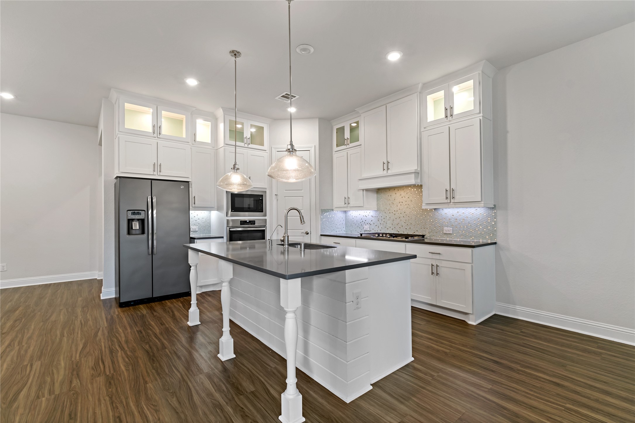 4802 Gingerwood Trace Lane Rosharon, TX 77583 - Photo 24 of 44 a kitchen with stainless steel appliances granite countertop a sink stove and refrigerator