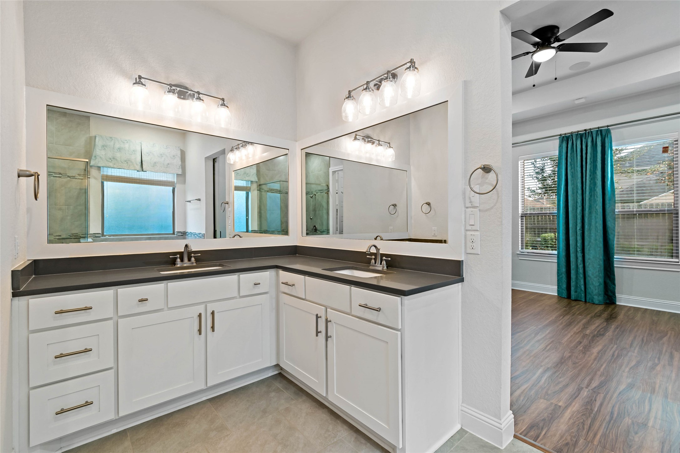 4802 Gingerwood Trace Lane Rosharon, TX 77583 - Photo 30 of 44 a hall with a sink and a large mirror