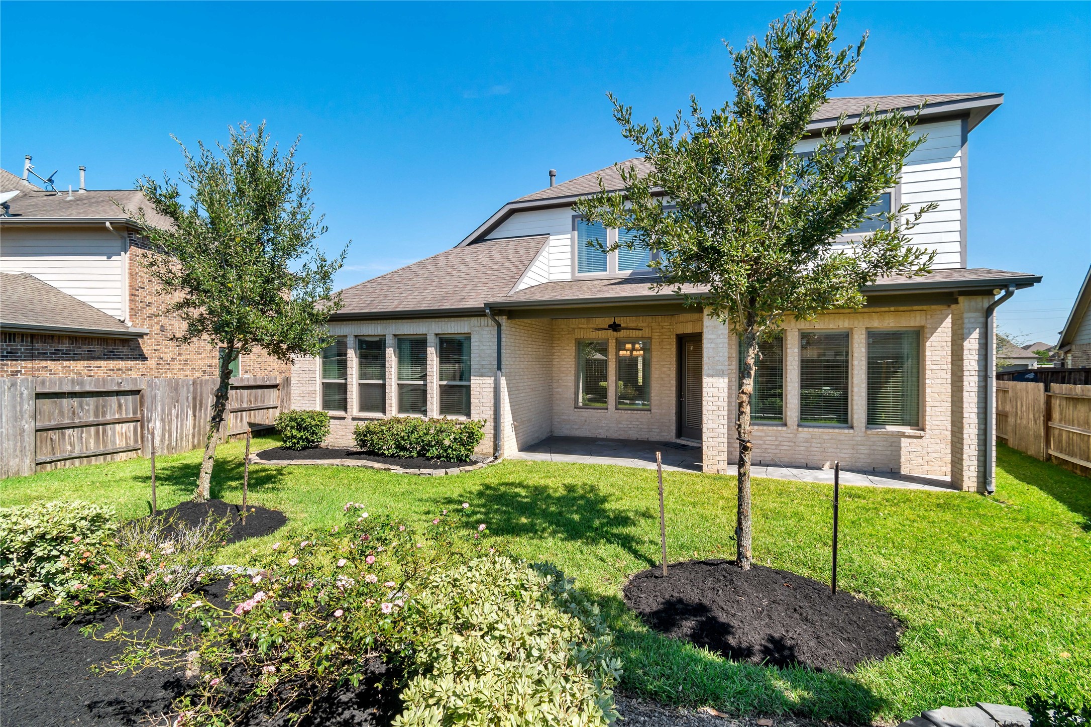 4802 Gingerwood Trace Lane Rosharon, TX 77583 - Photo 3 of 44 a view of a house with a yard and potted plants